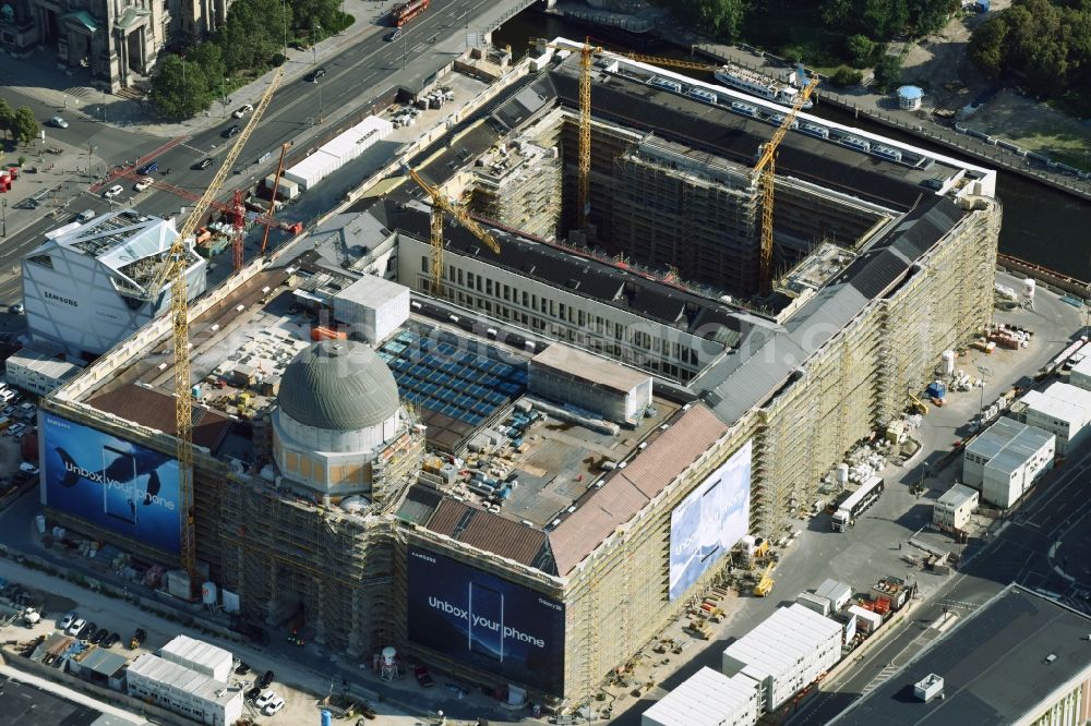 Berlin from above - Construction site for the new building the largest and most important cultural construction of the Federal Republic, the building of the Humboldt Forum in the form of the Berlin Palace