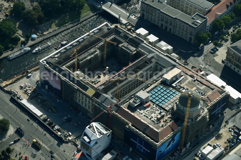 Berlin from above - Construction site for the new building the largest and most important cultural construction of the Federal Republic, the building of the Humboldt Forum in the form of the Berlin Palace