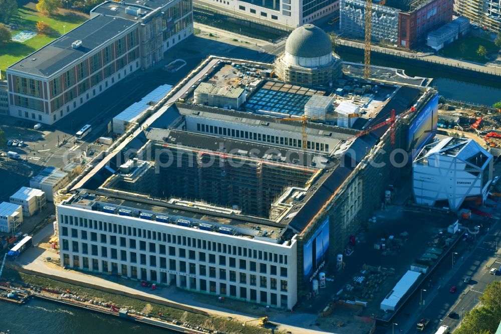 Berlin from above - Construction site for the new building the largest and most important cultural construction of the Federal Republic, the building of the Humboldt Forum in the form of the Berlin Palace