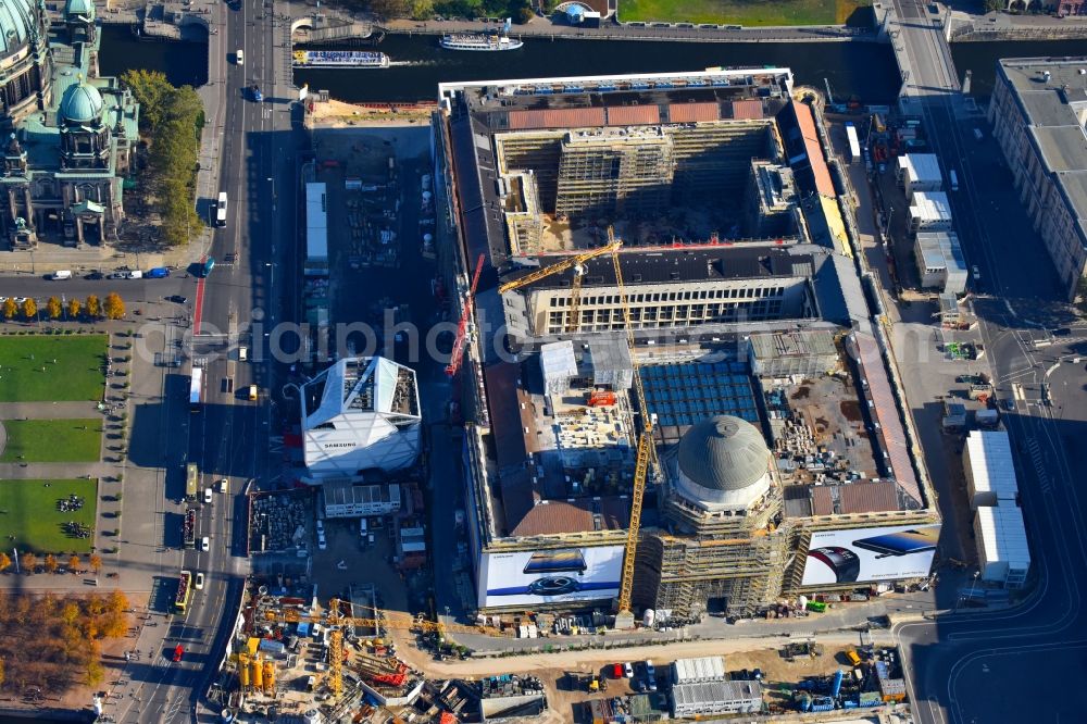 Berlin from above - Construction site for the new building the largest and most important cultural construction of the Federal Republic, the building of the Humboldt Forum in the form of the Berlin Palace