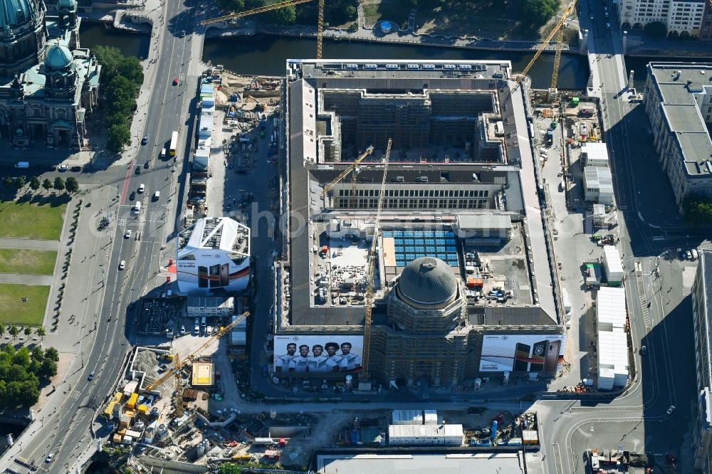 Berlin from above - Construction site for the new building the largest and most important cultural construction of the Federal Republic, the building of the Humboldt Forum in the form of the Berlin Palace