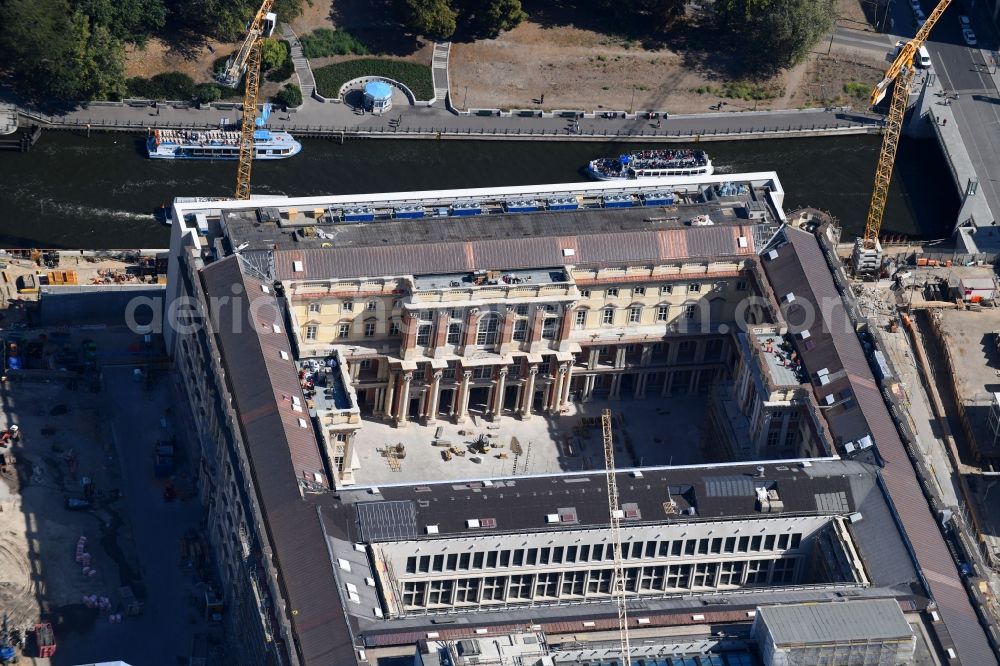 Berlin from above - Construction site for the new building the largest and most important cultural construction of the Federal Republic, the building of the Humboldt Forum in the form of the Berlin Palace