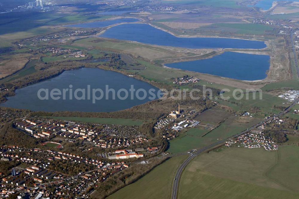 Aerial photograph Borna - Blick auf Borna Nord und das Umland nordlich von Borna: Speicherbecken, den Haubitzer See mit dem davor liegenden Haubitz und den Hainer See.