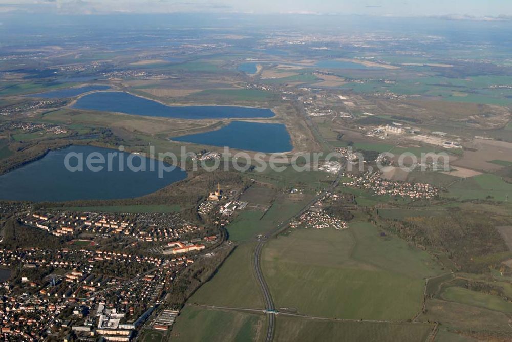 Borna from above - Blick auf das Umland nordlich von Borna und Borna Nord: Speicherbecken, den Haubitzer See mit dem davor liegenden Haubitz und den Hainer See sowie die Orte Eula und Kesselshain.