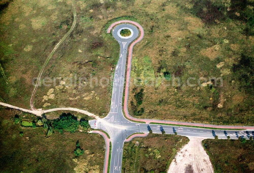 Königswusterhausen / Brandenburg from the bird's eye view: Die unfertige Straße im Gewerbegebiet Königswusterhausen - Ost, an der A10 und der Berliner-Chaussee, sowie der Chausseestraße.