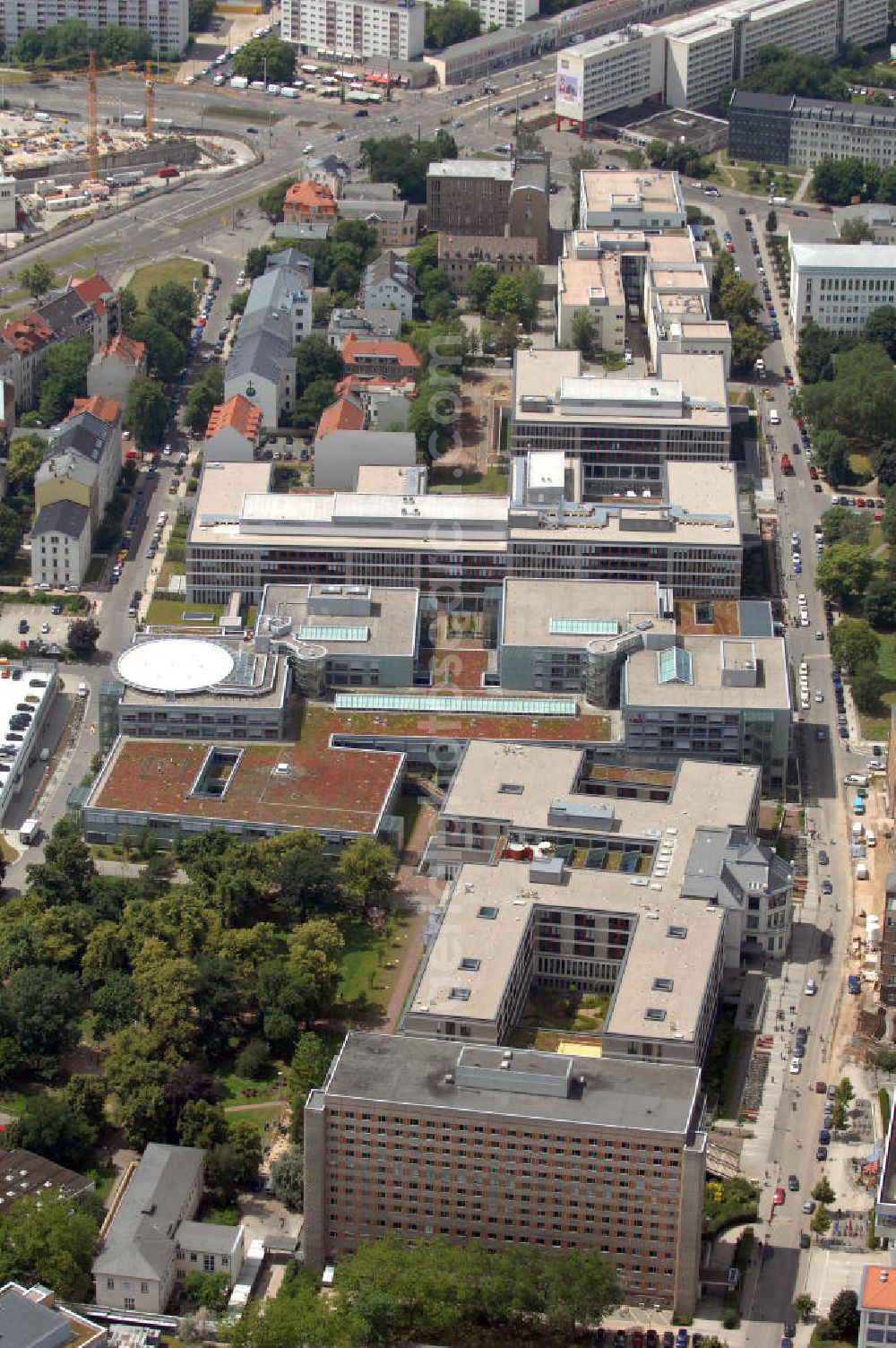 Aerial image Leipzig - Blick auf die neue Zentralstelle für betriebliche Logistik der Universitätsklinik Leipzig. Das Multifunktionsgebäude beherbergt das Zentrallager, die Medizintechnik, das technische Servicezentrum, die Klinikküche und den Hardwareservice der Klinik. Das Gebäude besitzt 5 Etagen und ist für eine problemlose Warenan- und auslieferung mittels LKW ausgelegt. Auf der obersten Ebene befindet sich ein Parkdeck. Das Gebäude wurde 2008 fertiggestellt. Verantwortlich für den Bau war die Firma Alpine Bau Deutschland AG. Kontakt Alpine Bau Deutschland AG: Fürholzener Str. 12, 85386 Eching, +49(0)89 327110, Fax +49(0)89 32711100; Kontakt Alpine Bau Deutschland AG, Niederlassung Halle-Leipzig: Alpinenstr. 1, 06254 Zöschen, Tel. +49(0)34638 66360, Fax +49(0)34638 66380, Email: zoeschen@alpine-bau.de