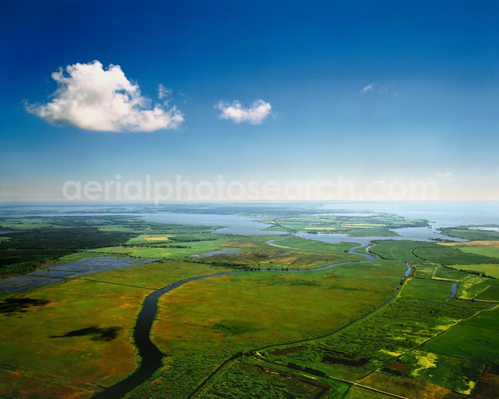 Anklam from the bird's eye view: The river Peene and the Peenestrom strait in Anklam in the state of Mecklenburg-Vorpommern. The strait is a stream of the Baltic Sea. View towards the mouth of the river Peene which opens into the stream from the West. The Valley of the river - Lower Penee Valley here - is the largest connected low moor region of Europe