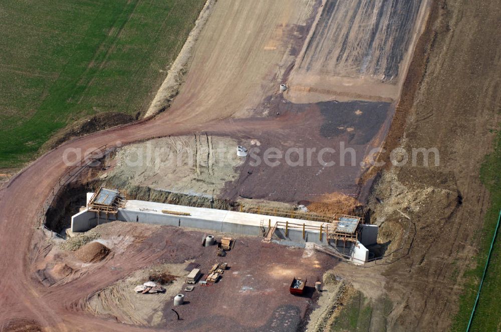 Ettenhausen from the bird's eye view: Blick auf die Baustelle einer Unterführung der A4 bei Ettenhausen. Der Neubau ist Teil des Projekt Nordverlegung / Umfahrung Hörselberge der Autobahn E40 / A4 in Thüringen bei Eisenach. Durchgeführt werden die im Zuge dieses Projektes notwendigen Arbeiten unter an derem von den Mitarbeitern der Niederlassung Weimar der EUROVIA Verkehrsbau Union sowie der Niederlassungen Abbruch und Erdbau, Betonstraßenbau, Ingenieurbau und TECO Schallschutz der EUROVIA Beton sowie der DEGES.