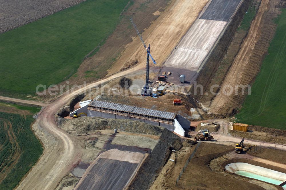 Aerial photograph Großenlupnitz - Blick auf die Baustelle einer Unterführung der A4 bei Großenlupnitz. Der Neubau ist Teil des Projekt Nordverlegung / Umfahrung Hörselberge der Autobahn E40 / A4 in Thüringen bei Eisenach. Durchgeführt werden die im Zuge dieses Projektes notwendigen Arbeiten unter an derem von den Mitarbeitern der Niederlassung Weimar der EUROVIA Verkehrsbau Union sowie der Niederlassungen Abbruch und Erdbau, Betonstraßenbau, Ingenieurbau und TECO Schallschutz der EUROVIA Beton sowie der DEGES.