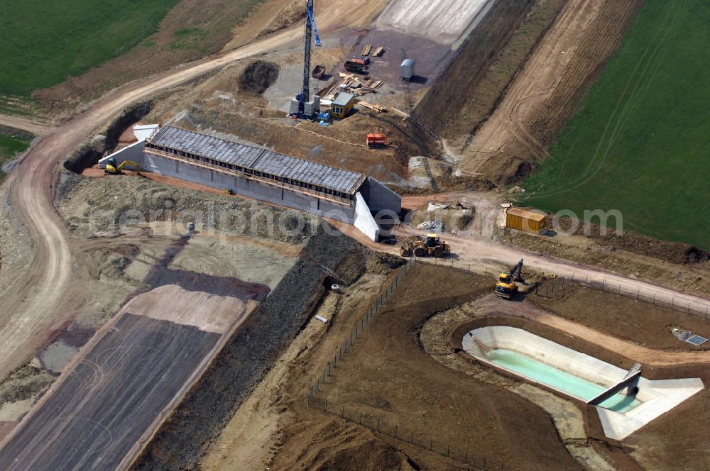 Großenlupnitz from the bird's eye view: Blick auf die Baustelle einer Unterführung der A4 bei Großenlupnitz. Der Neubau ist Teil des Projekt Nordverlegung / Umfahrung Hörselberge der Autobahn E40 / A4 in Thüringen bei Eisenach. Durchgeführt werden die im Zuge dieses Projektes notwendigen Arbeiten unter an derem von den Mitarbeitern der Niederlassung Weimar der EUROVIA Verkehrsbau Union sowie der Niederlassungen Abbruch und Erdbau, Betonstraßenbau, Ingenieurbau und TECO Schallschutz der EUROVIA Beton sowie der DEGES.