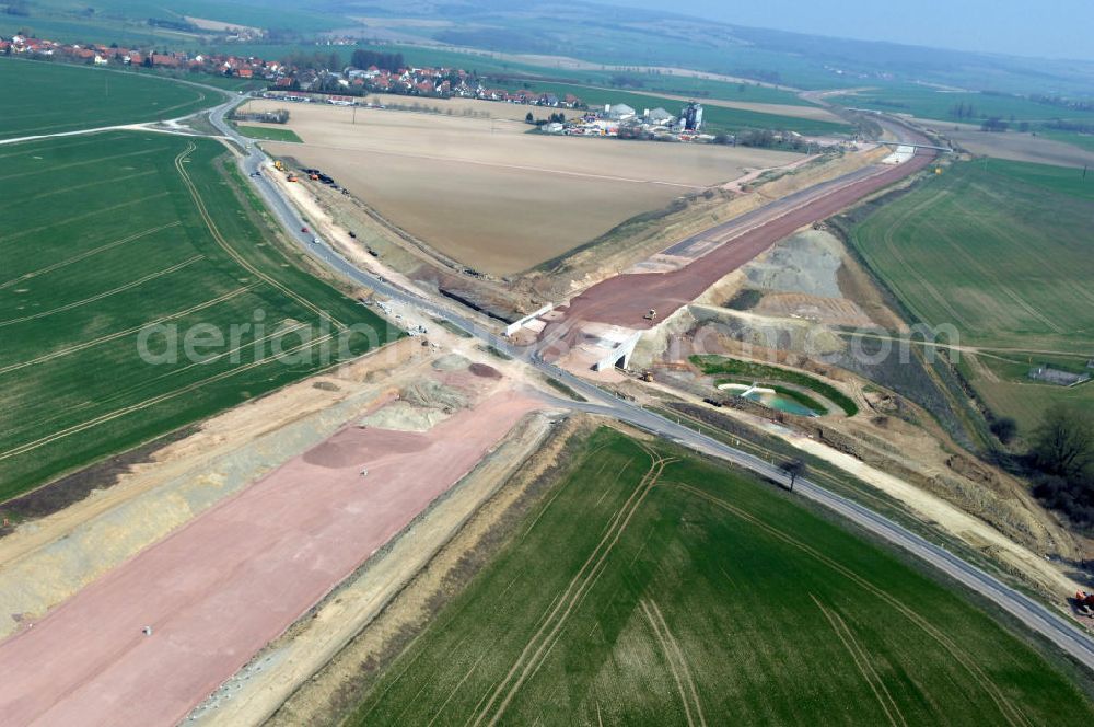 Aerial image Neukirchen - Blick auf die Baustelle einer Unterführung der A4 für die Strassenverbindung zwischen Stregda und Neukirchen, sowie ein Regenrückhaltebecken. Der Neubau ist Teil des Projekt Nordverlegung / Umfahrung Hörselberge der Autobahn E40 / A4 in Thüringen bei Eisenach. Durchgeführt werden die im Zuge dieses Projektes notwendigen Arbeiten unter an derem von den Mitarbeitern der Niederlassung Weimar der EUROVIA Verkehrsbau Union sowie der Niederlassungen Abbruch und Erdbau, Betonstraßenbau, Ingenieurbau und TECO Schallschutz der EUROVIA Beton sowie der DEGES.