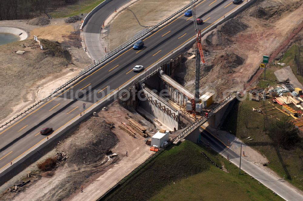 Eisenach from the bird's eye view: Blick auf die Baustelle einer Unterführung der A4 östlich der Raststätte Eisenach. Der Neubau ist Teil des Projekt Nordverlegung / Umfahrung Hörselberge der Autobahn E40 / A4 in Thüringen bei Eisenach. Durchgeführt werden die im Zuge dieses Projektes notwendigen Arbeiten unter an derem von den Mitarbeitern der Niederlassung Weimar der EUROVIA Verkehrsbau Union sowie der Niederlassungen Abbruch und Erdbau, Betonstraßenbau, Ingenieurbau und TECO Schallschutz der EUROVIA Beton sowie der DEGES.