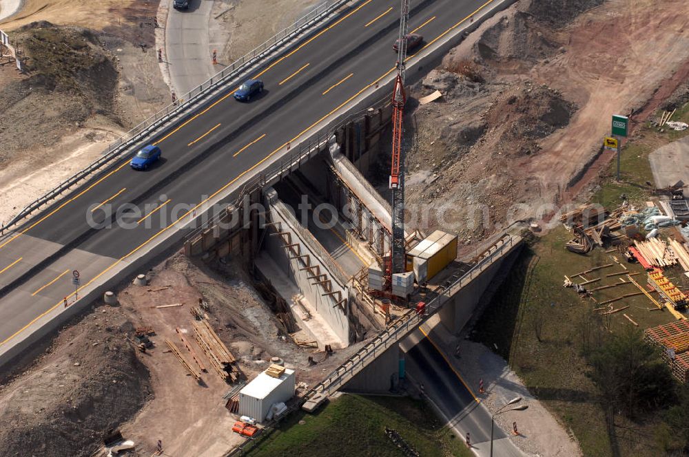 Aerial image Eisenach - Blick auf die Baustelle einer Unterführung der A4 östlich der Raststätte Eisenach. Der Neubau ist Teil des Projekt Nordverlegung / Umfahrung Hörselberge der Autobahn E40 / A4 in Thüringen bei Eisenach. Durchgeführt werden die im Zuge dieses Projektes notwendigen Arbeiten unter an derem von den Mitarbeitern der Niederlassung Weimar der EUROVIA Verkehrsbau Union sowie der Niederlassungen Abbruch und Erdbau, Betonstraßenbau, Ingenieurbau und TECO Schallschutz der EUROVIA Beton sowie der DEGES.