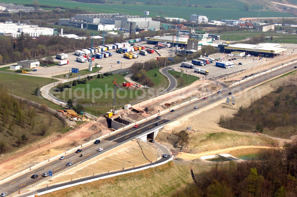 Eisenach from the bird's eye view: Blick auf die Baustelle einer Unterführung der A4 mit Regenrückhaltebecken östlich der Raststätte Eisenach. Der Neubau ist Teil des Projekt Nordverlegung / Umfahrung Hörselberge der Autobahn E40 / A4 in Thüringen bei Eisenach. Durchgeführt werden die im Zuge dieses Projektes notwendigen Arbeiten unter an derem von den Mitarbeitern der Niederlassung Weimar der EUROVIA Verkehrsbau Union sowie der Niederlassungen Abbruch und Erdbau, Betonstraßenbau, Ingenieurbau und TECO Schallschutz der EUROVIA Beton sowie der DEGES.