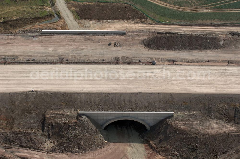 Aerial photograph Eisenach - Blick auf die Baustelle einer Unterführung der A4 für die Strassenverbindung zwischen Krauthausen und Eisenach. Der Neubau ist Teil des Projekt Nordverlegung / Umfahrung Hörselberge der Autobahn E40 / A4 in Thüringen bei Eisenach. Durchgeführt werden die im Zuge dieses Projektes notwendigen Arbeiten unter an derem von den Mitarbeitern der Niederlassung Weimar der EUROVIA Verkehrsbau Union sowie der Niederlassungen Abbruch und Erdbau, Betonstraßenbau, Ingenieurbau und TECO Schallschutz der EUROVIA Beton sowie der DEGES.