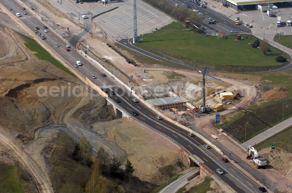 Eisenach from above - Blick auf die Baustelle einer Unterführung der A4 westlich der Raststätte Eisenach. Der Neubau ist Teil des Projekt Nordverlegung / Umfahrung Hörselberge der Autobahn E40 / A4 in Thüringen bei Eisenach. Durchgeführt werden die im Zuge dieses Projektes notwendigen Arbeiten unter an derem von den Mitarbeitern der Niederlassung Weimar der EUROVIA Verkehrsbau Union sowie der Niederlassungen Abbruch und Erdbau, Betonstraßenbau, Ingenieurbau und TECO Schallschutz der EUROVIA Beton sowie der DEGES.