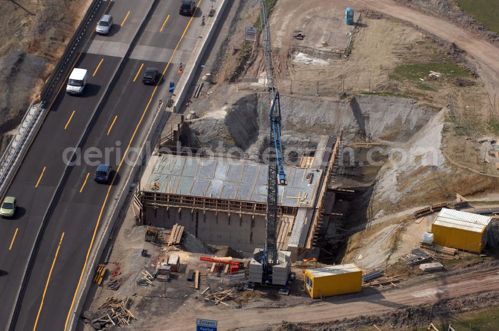 Eisenach from above - Blick auf die Baustelle einer Unterführung der A4 westlich der Raststätte Eisenach. Der Neubau ist Teil des Projekt Nordverlegung / Umfahrung Hörselberge der Autobahn E40 / A4 in Thüringen bei Eisenach. Durchgeführt werden die im Zuge dieses Projektes notwendigen Arbeiten unter an derem von den Mitarbeitern der Niederlassung Weimar der EUROVIA Verkehrsbau Union sowie der Niederlassungen Abbruch und Erdbau, Betonstraßenbau, Ingenieurbau und TECO Schallschutz der EUROVIA Beton sowie der DEGES.