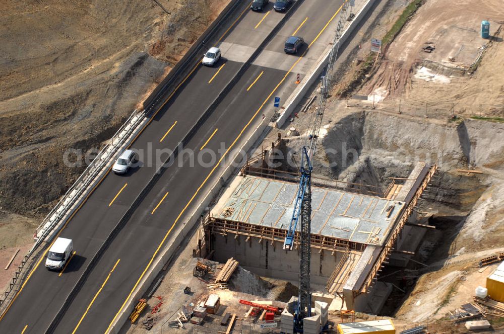 Aerial image Eisenach - Blick auf die Baustelle einer Unterführung der A4 westlich der Raststätte Eisenach. Der Neubau ist Teil des Projekt Nordverlegung / Umfahrung Hörselberge der Autobahn E40 / A4 in Thüringen bei Eisenach. Durchgeführt werden die im Zuge dieses Projektes notwendigen Arbeiten unter an derem von den Mitarbeitern der Niederlassung Weimar der EUROVIA Verkehrsbau Union sowie der Niederlassungen Abbruch und Erdbau, Betonstraßenbau, Ingenieurbau und TECO Schallschutz der EUROVIA Beton sowie der DEGES.