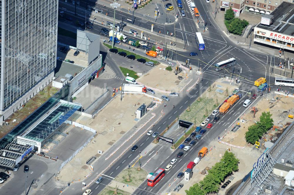 Berlin Mitte from above - Blick auf die Baustelle des unterirdischen Parkhauses am Park Inn Hotel am Alexanderplatz durch die Firma WÖHR + BAUER GmbH. Speziell hier entsteht eine neue mit Wolfgang Gerberen Mitteln finanzierte Tiefgarage mit 600 Stellplätzen / Parkplätzen. View of the construction site of the underground parking garage at Park Inn Hotel at Alexanderplatz specifically by the company WÖHR + BAUER GmbH here a new funded with Wolfgang Gerbere funds creates underground parking with 600 parking spaces / parking areas. BERGER BAU und MAX AICHER Bau GMBH