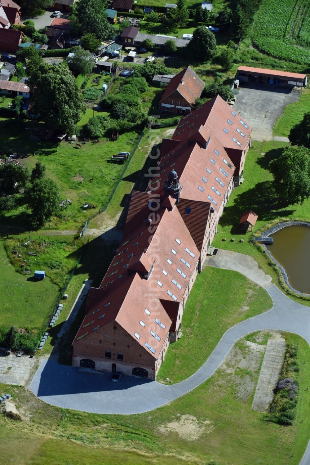 Brahlstorf from the bird's eye view: Administration building of the company Lunge Lauf- and Sportschuh GmbH on Schlossstrasse in the district Duessin in Brahlstorf in the state Mecklenburg - Western Pomerania, Germany