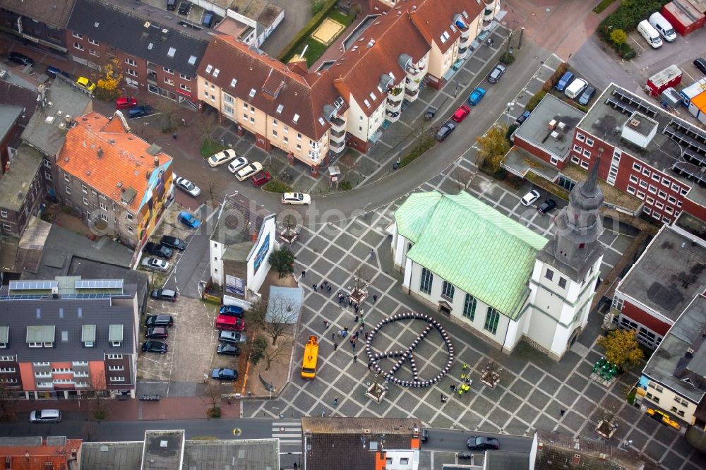 Aerial image Hamm - Participants of the action on the event site tons of artworks in the Luther Quarter in Hamm in North Rhine-Westphalia. Sign and symbol set - recyclable tons and trash cans are for presentation in circular form as Peace
