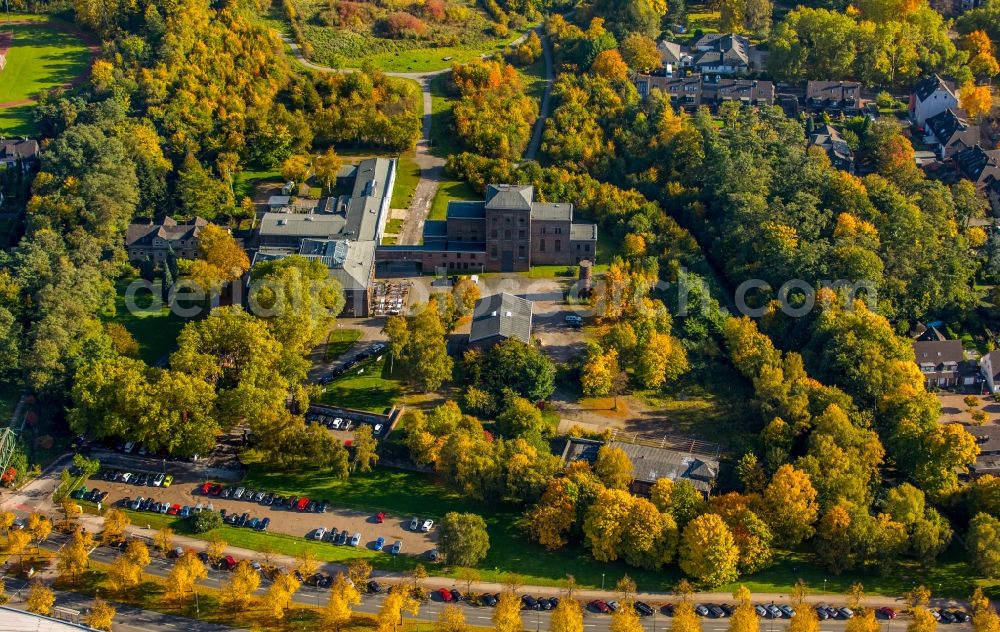 Aerial image Essen - Events location and restaurant Machine House Essen - Zeche Carl in Essen in the state of North Rhine-Westphalia. The historic industrial building is located in an autumnal and colourful forest