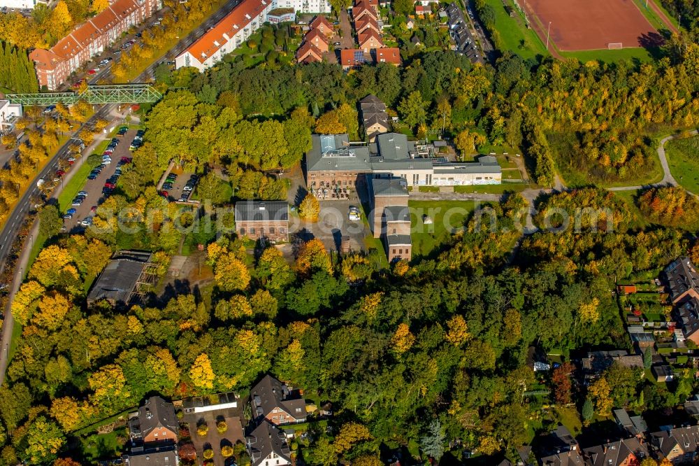 Essen from above - Events location and restaurant Machine House Essen - Zeche Carl in Essen in the state of North Rhine-Westphalia. The historic industrial building is located in an autumnal and colourful forest