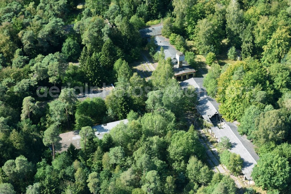 Parmen from above - Decay and vegetation growth of the ruins of the building complex of the former military barracks of NVA Nationale Volksarmee formerly GDR in Parmen in the state Brandenburg