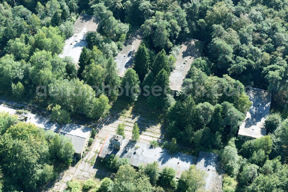 Parmen from the bird's eye view: Decay and vegetation growth of the ruins of the building complex of the former military barracks of NVA Nationale Volksarmee formerly GDR in Parmen in the state Brandenburg