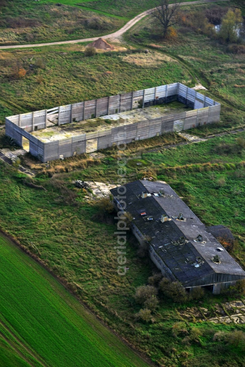 Aerial photograph Schönhausen - Decaying ruins of an LPG agricultural cooperative in the former GDR Schoenhausen in Mecklenburg - Western Pomerania