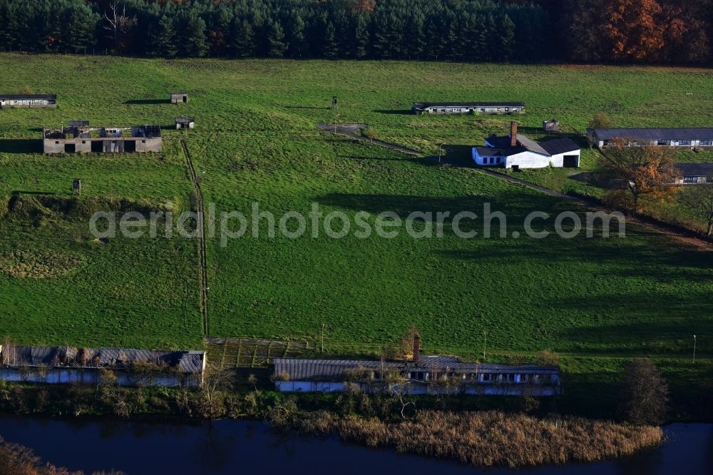 Grünow from the bird's eye view: Decaying remnants of ruins of stables and barracks of animal breeding operation in Grünow in Mecklenburg - Western Pomerania