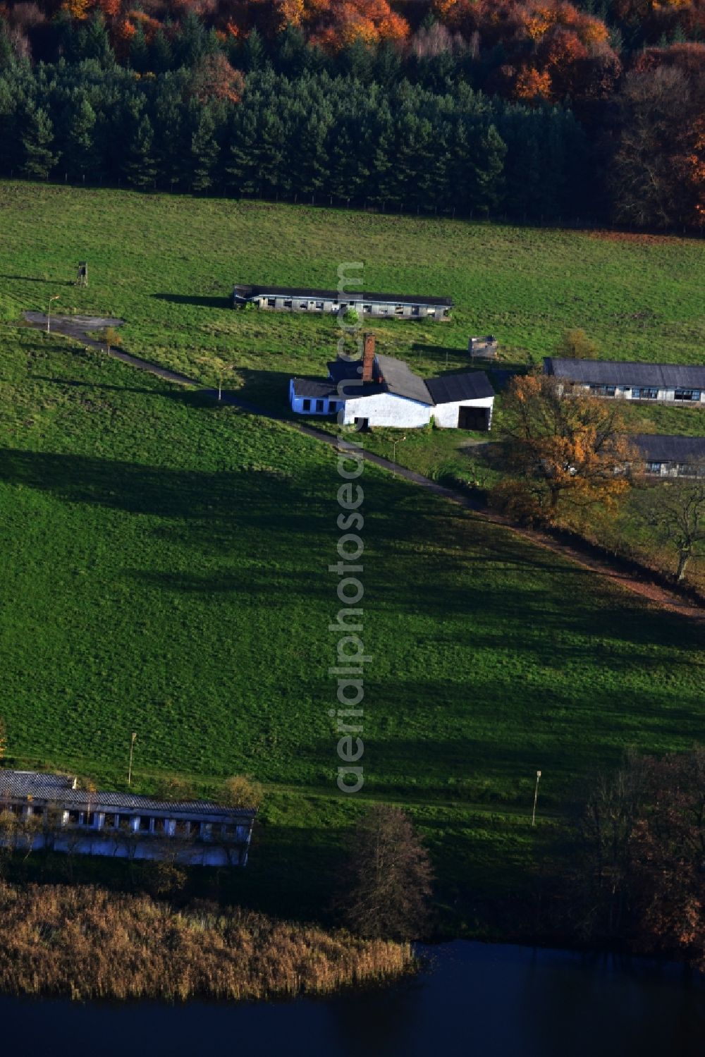 Aerial image Grünow - Decaying remnants of ruins of stables and barracks of animal breeding operation in Grünow in Mecklenburg - Western Pomerania