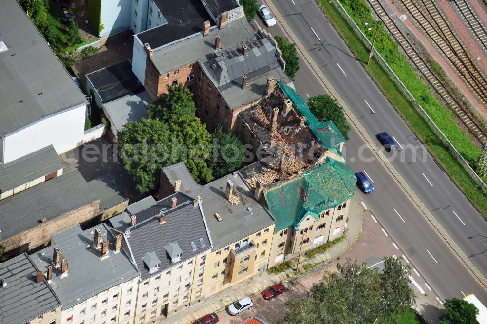 Aerial photograph Halle an der Saale - View of dilapidated buildings in Dzondi street in the Mediziner district in Halle. The Halle Housing Society (HWG) is investing in the renovation of the district