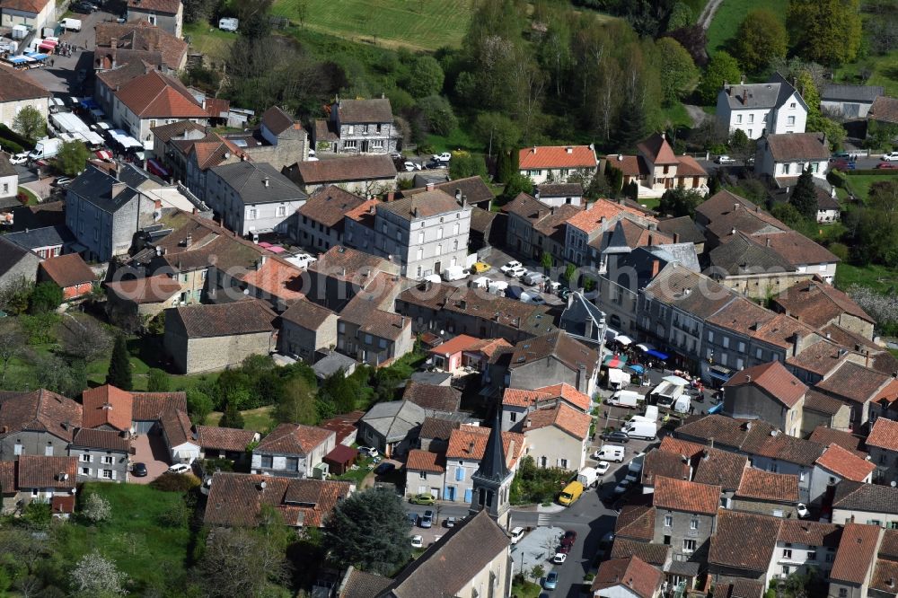 Aerial image Piégut-Pluviers - Sale and food stands and trade stalls in the market place at the town hall of the inner city center in Piegut-Pluviers in Aquitaine Limousin Poitou-Charentes, France