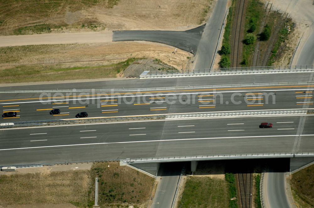 Schönefeld from the bird's eye view: Blick auf den Bereich der Stadtautobahn / Zubringer A113n als südöstliches Tor zur Hauptstadt nach der Verkehrsfreigabe. Unter Berücksichtigung des Flughafens Berlin Brandenburg International wurde eine Verkehrskonzeption für den Ausbau des Straßennetzes im Raum Berlin-Schönefeld erarbeitet, die zwei Stufen umfasste. Die erste Stufe sah den vierstreifigen Ausbau der Bundesstraßen B 96a und B 179 mit der Anbindung des Flughafens über zwei Knotenpunkte vor. Inhalt der zweiten Stufe war der Anschluß der Bundesautobahn A 113 neu an die B 96a und B 179. SCHÜßLER Plan Ingenieurgesellschaft, BATEG, EUROVIA, Schüßler Plan