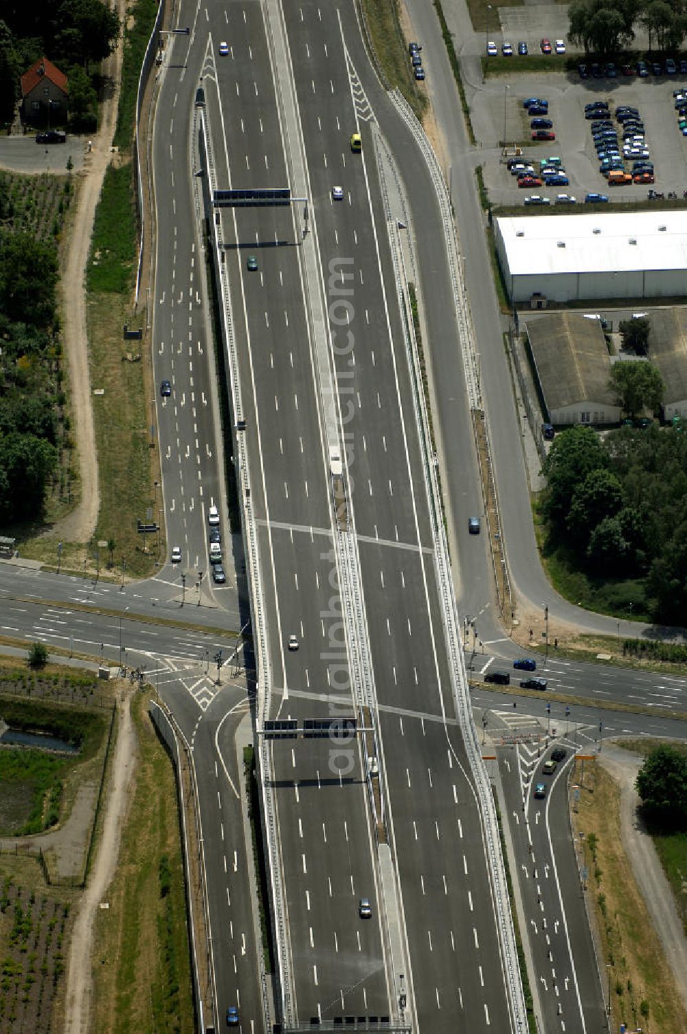 Schönefeld from the bird's eye view: Blick auf den Bereich der Stadtautobahn / Zubringer A113n als südöstliches Tor zur Hauptstadt nach der Verkehrsfreigabe. Unter Berücksichtigung des Flughafens Berlin Brandenburg International wurde eine Verkehrskonzeption für den Ausbau des Straßennetzes im Raum Berlin-Schönefeld erarbeitet, die zwei Stufen umfasste. Die erste Stufe sah den vierstreifigen Ausbau der Bundesstraßen B 96a und B 179 mit der Anbindung des Flughafens über zwei Knotenpunkte vor. Inhalt der zweiten Stufe war der Anschluß der Bundesautobahn A 113 neu an die B 96a und B 179. SCHÜßLER Plan Ingenieurgesellschaft, BATEG, EUROVIA, Schüßler Plan