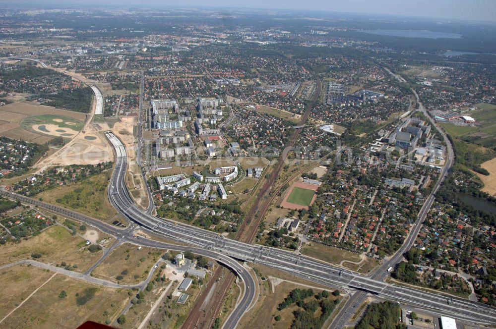 Schönefeld from the bird's eye view: Blick auf den Bereich der Stadtautobahn / Zubringer A113n als südöstliches Tor zur Hauptstadt nach der Verkehrsfreigabe. Unter Berücksichtigung des Flughafens Berlin Brandenburg International wurde eine Verkehrskonzeption für den Ausbau des Straßennetzes im Raum Berlin-Schönefeld erarbeitet, die zwei Stufen umfasste. Die erste Stufe sah den vierstreifigen Ausbau der Bundesstraßen B 96a und B 179 mit der Anbindung des Flughafens über zwei Knotenpunkte vor. Inhalt der zweiten Stufe war der Anschluß der Bundesautobahn A 113 neu an die B 96a und B 179. SCHÜßLER Plan Ingenieurgesellschaft, BATEG, EUROVIA