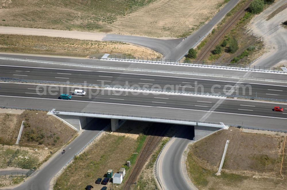 Aerial image Schönefeld - Blick auf den Bereich der Stadtautobahn / Zubringer A113n als südöstliches Tor zur Hauptstadt nach der Verkehrsfreigabe. Unter Berücksichtigung des Flughafens Berlin Brandenburg International wurde eine Verkehrskonzeption für den Ausbau des Straßennetzes im Raum Berlin-Schönefeld erarbeitet, die zwei Stufen umfasste. Die erste Stufe sah den vierstreifigen Ausbau der Bundesstraßen B 96a und B 179 mit der Anbindung des Flughafens über zwei Knotenpunkte vor. Inhalt der zweiten Stufe war der Anschluß der Bundesautobahn A 113 neu an die B 96a und B 179. SCHÜßLER Plan Ingenieurgesellschaft, BATEG, EUROVIA