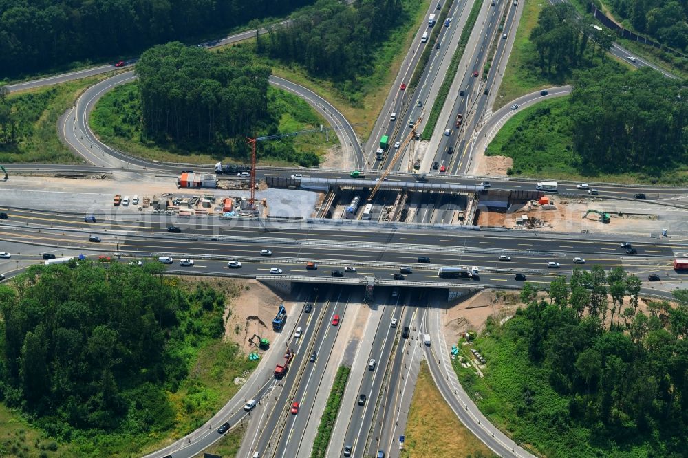 Köln from the bird's eye view: Traffic flow at the intersection- motorway A 1 - A57 Koeln-Nord in the district Ossendorf in Cologne in the state North Rhine-Westphalia, Germany