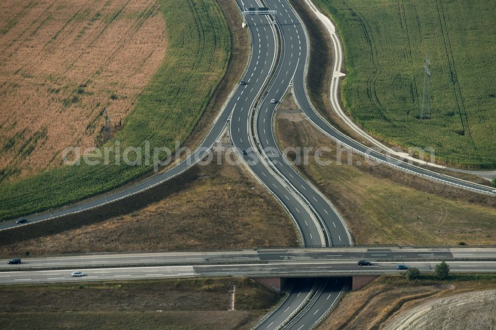 Niederröblingen (Helme) from the bird's eye view: Traffic flow at the intersection- motorway A 71 - A38 in Niederroeblingen (Helme) in the state Saxony-Anhalt