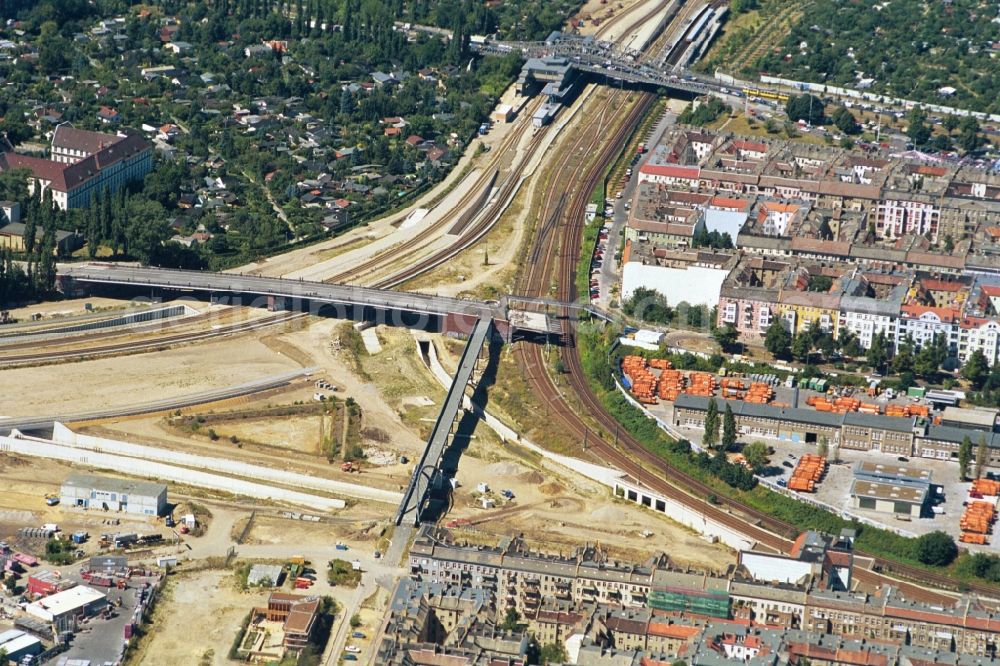 Berlin from above - The transport cross Bornholmer-Strasse in the northern part of the Berlin S-Bahn-Ring. Good to see the Bornholm Bridge and the bridge of Behmstraße both connect the boroughs of Berlin-Prenzlauer Berg and Berlin-Wedding. In the foreground the footbridge to Schwedter Strasse