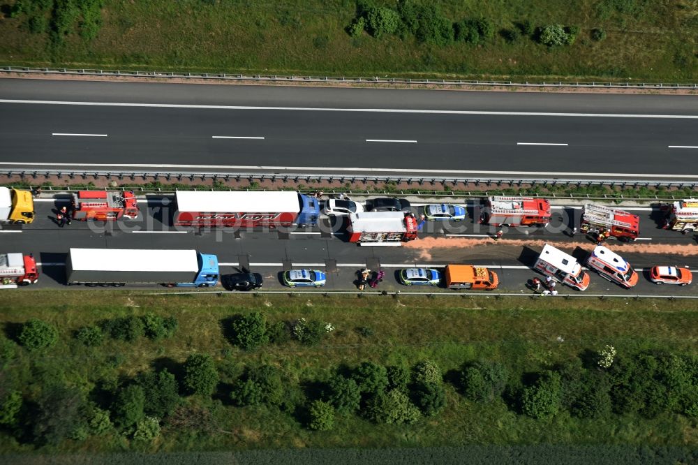 Plötzkau from the bird's eye view: Traffic accident with highway traffic jam on the route of BAB A14 by a truck lorry in Ploetzkau in the state Saxony-Anhalt