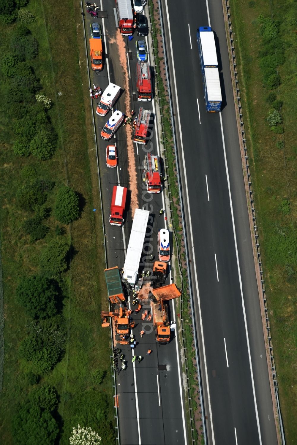 Plötzkau from the bird's eye view: Traffic accident with highway traffic jam on the route of BAB A14 by a truck lorry in Ploetzkau in the state Saxony-Anhalt