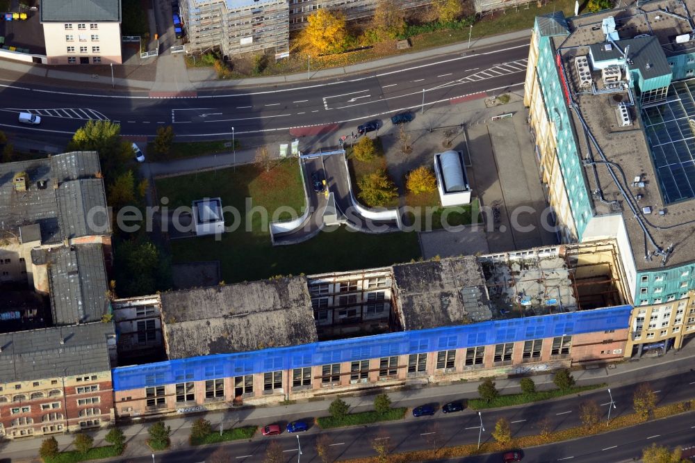 Aerial photograph Leipzig - View of the abandoned building complex Bugra Messehaus at Gerichtsweg in Leipzig in Saxony. The building was the venue of the book trade and graphics fair in 1914 and was then used as a convention and exhibition center. The building is currently unused and heavily threatened by decay