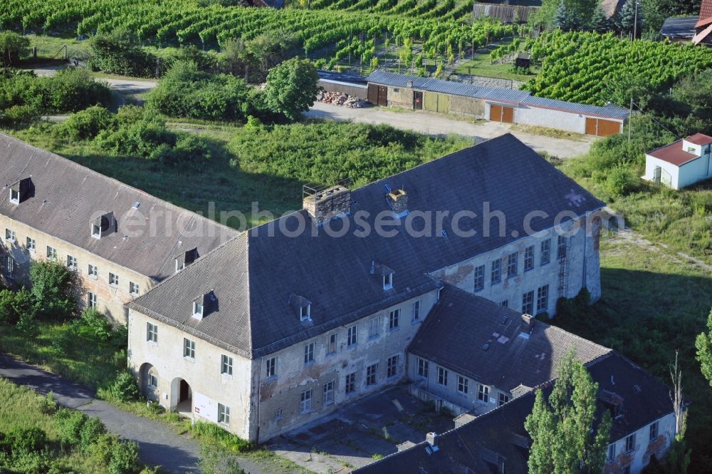 Aerial photograph Laucha - View at the deserted main building of the aerodrome in Laucha in the federal state of Saxony-Anhalt. From 1937 until 1945 it accommodates the Reichs sailplane school with up to 130 sailplanes. After then the sailplane school was operated by the FDJ Free German Youth it was overtaken in 1952 by the GST Society for Sports and Technology but in 1961 it was closed again