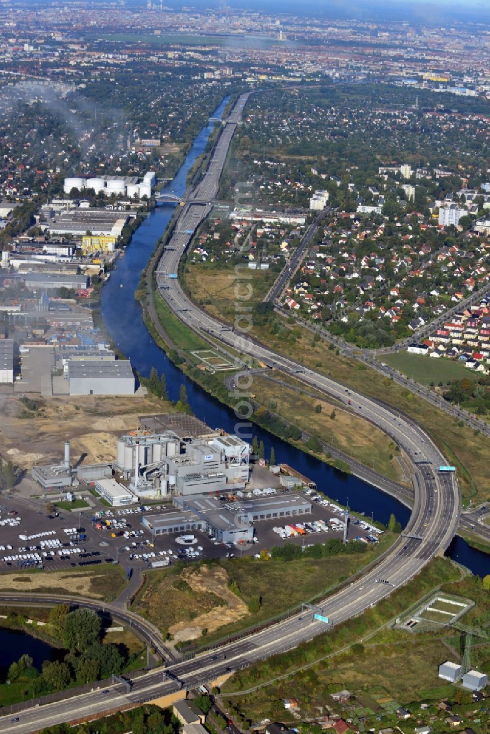 Berlin from above - View of the course of the federal autobahn A113 and Europastrasse E36 along the channel Teltowkanal on the border of the districts Rudow, Johannisthal and Altglienicke in Berlin. Located along the course of the freeway is the event venue Kraftwerk Berlin in a decommissioned combined heat and power station at Koepenicker Strasse and an industrial area at Kanalstrasse