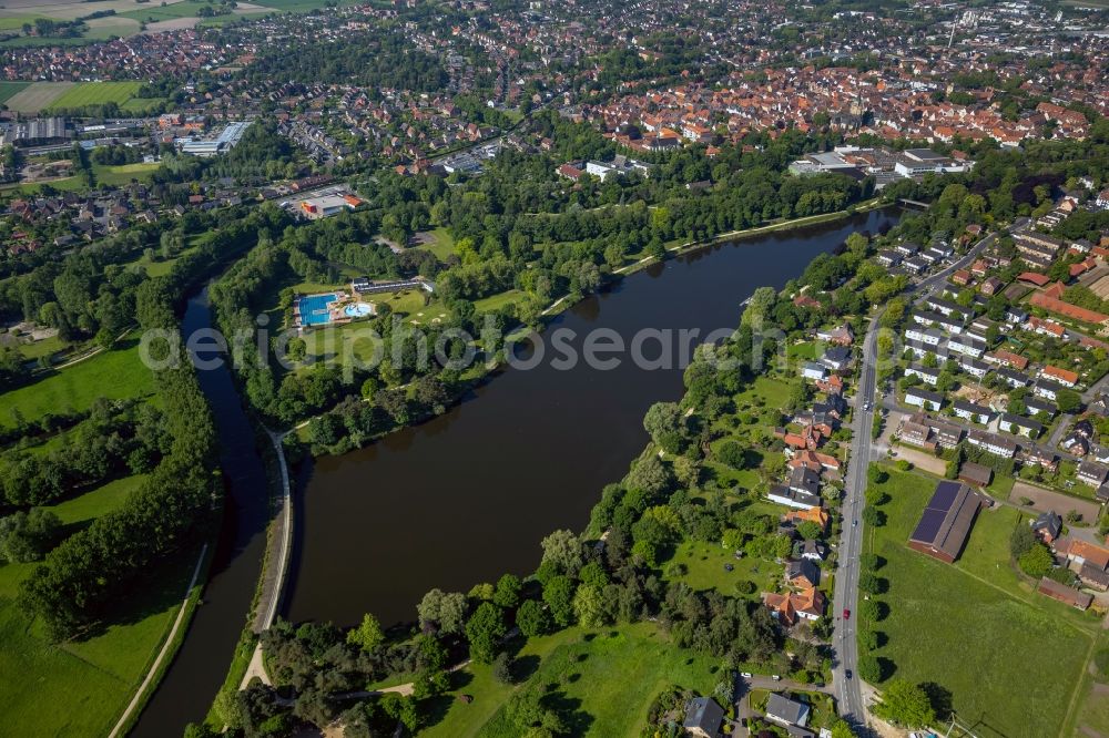 Aerial image Warendorf - The course of the Ems through the city Warendorf in the state North Rhine-Westphalia. The river forms with its course an island in the Ems and the Emssee