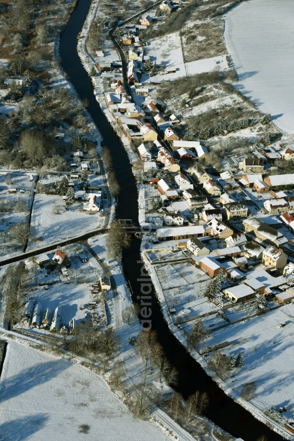 Niederfinow from the bird's eye view: View of the snow-covered winterly village of Niederfinow along the river of Old Finow in the state of Brandenburg