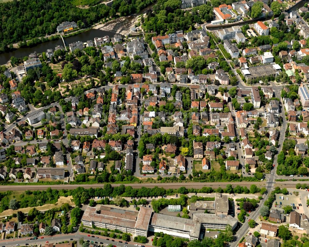 Aerial image Bad Kreuznach - Course of the river Nahe in the West of Bad Kreuznach in the state of Rhineland-Palatinate. Bad Kreuznach is a spa town and county capital and is located on the rivers Nahe and Ellerbach. Apart from historic buildings and parts of the town, there are also several residential areas with multi-family homes and estates. There are several landmarks spread along the river Nahe, especially in the Northwest of the town