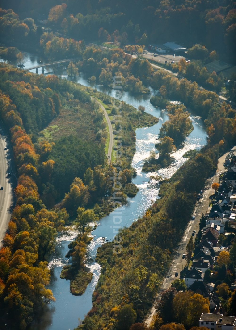 Neheim from above - Course of the river Ruhr being renaturated in Neheim in the state of North Rhine-Westphalia. The river takes its course through the autumnal landscape